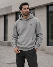 NORVEN Origin Essential Hoodie in grey, styled with charcoal tailored trousers