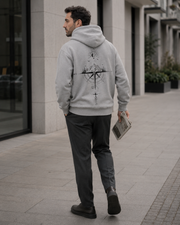 Grey NORVEN Origin Essential Hoodie with charcoal trousers for a city-day look