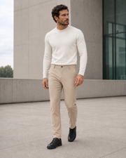 NORVEN Ascent Tailored Trouser in Sand styled with a Warm White fine-gauge crewneck