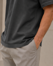 Close-up of the fabric drape and hem of the NORVEN Origin Heavyweight Tee in Charcoal